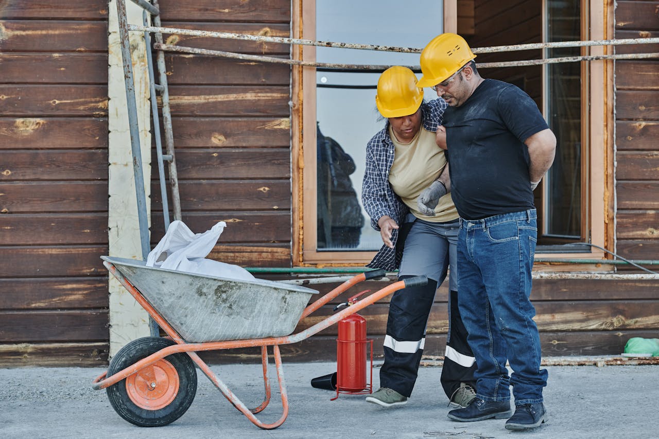 Injured man at work with back pain