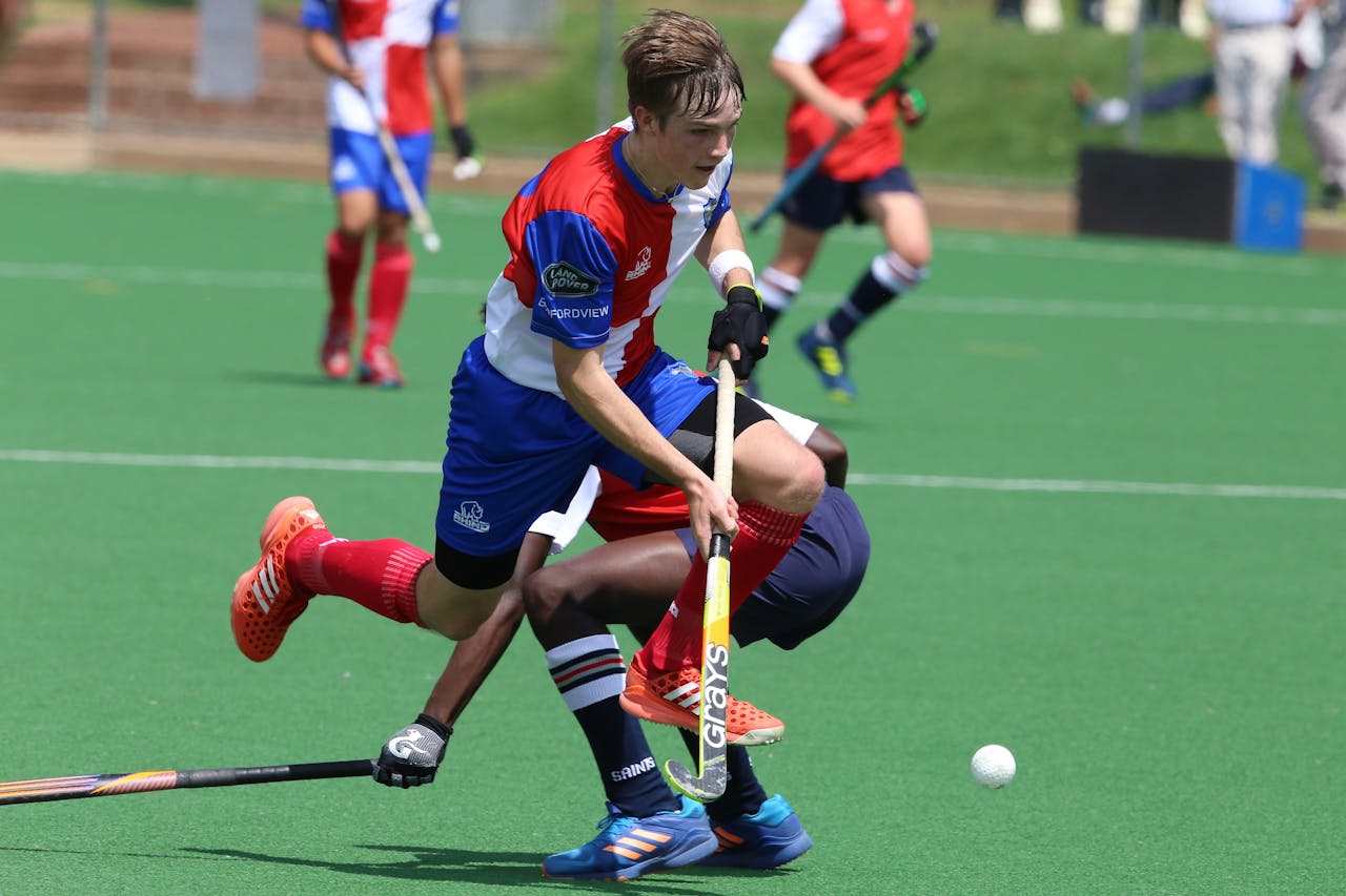 Hockey player running with ball